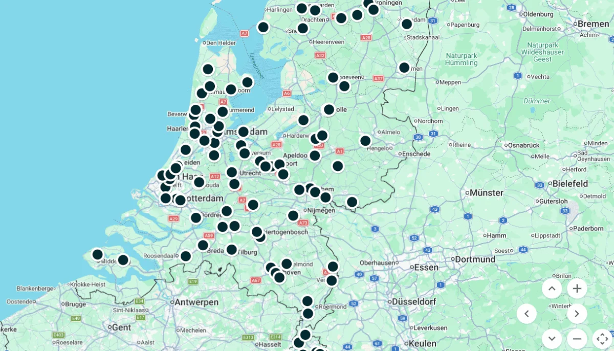 Map of the Netherlands showing numerous black location markers across various cities and regions.
