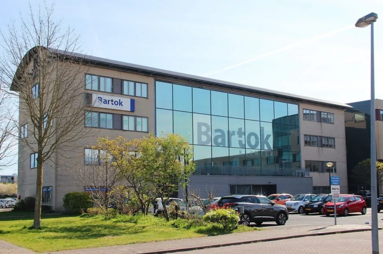 Exterior of the Bartok Kliniek building with a large glass facade in Almere.